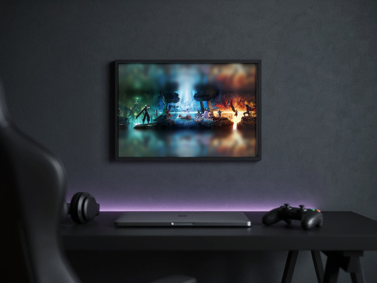 Final Fantasy VII Revelation Trilogy Art poster in a black frame above a gaming desk (horizontal)
