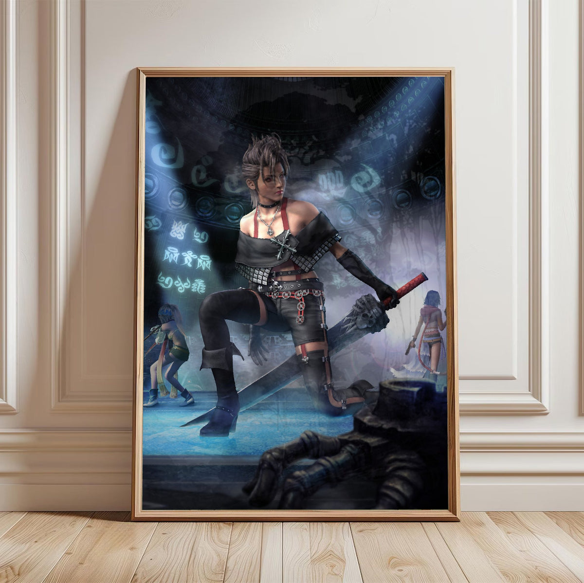 Final Fantasy X-2 Paine Key Art poster in a light oak frame leaning against a white wall