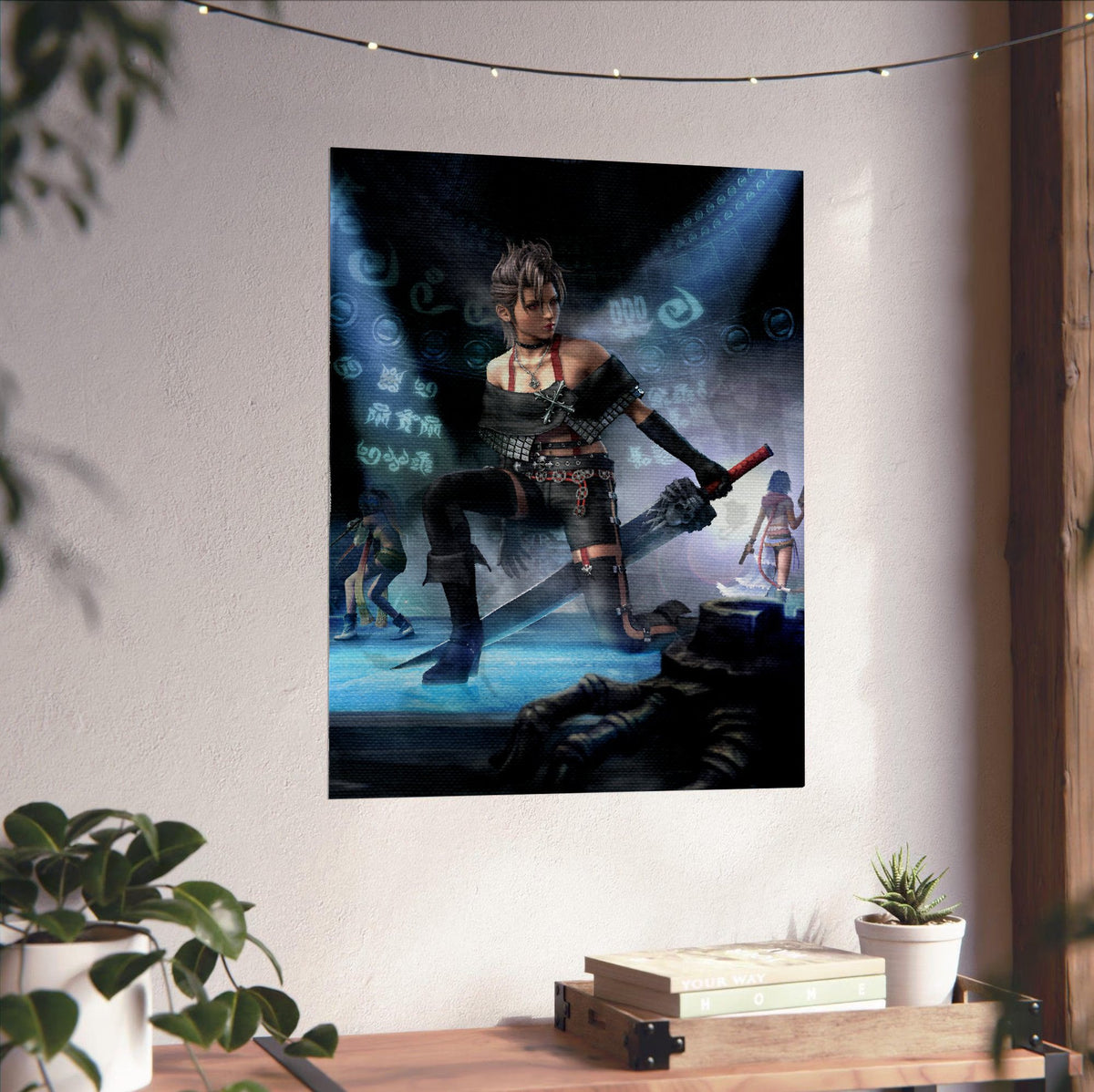 Final Fantasy X-2 Paine Key Art poster unframed on a white wall above a desk