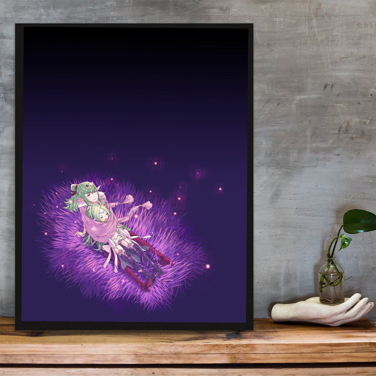 Fire Emblem Awakening Tiki and Nowi poster in a black frame on a wooden shelf against concrete