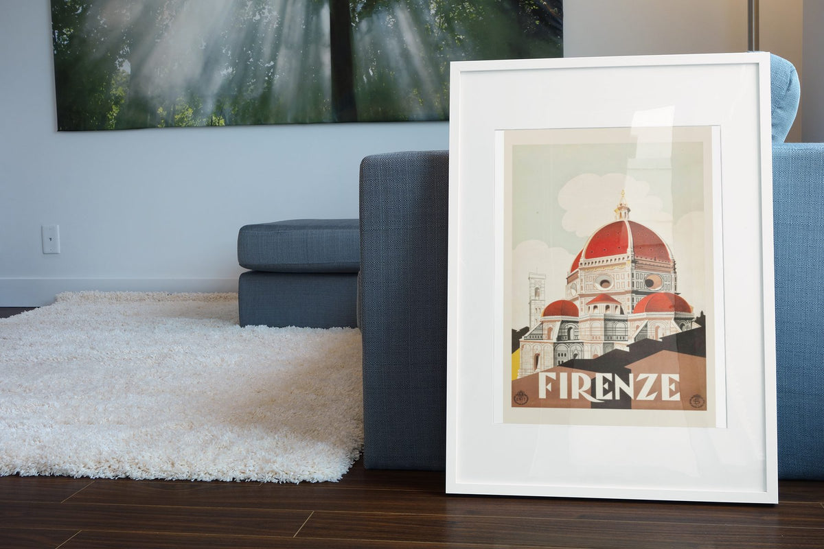 Firenze Duomo poster leaning beside a blue sofa