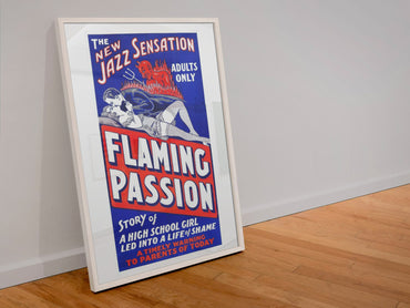 Flaming Passion poster in a white frame leaning against a wall