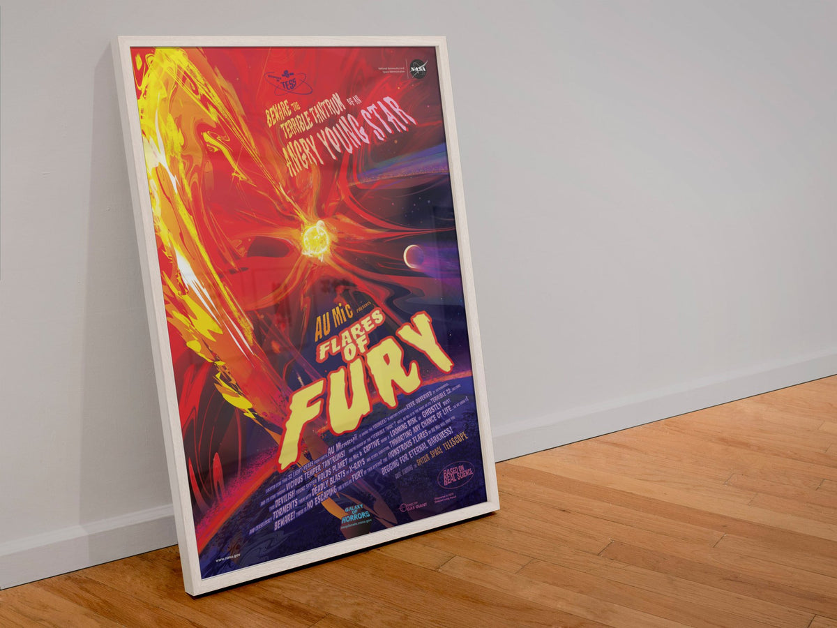 Flares of Fury, NASA Galaxy of Horrors poster in a white frame leaning against a wall