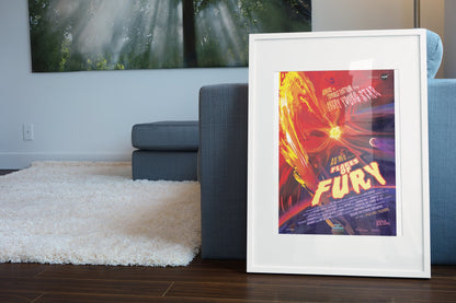 Flares of Fury, NASA Galaxy of Horrors poster in a white frame leaning beside a blue sofa