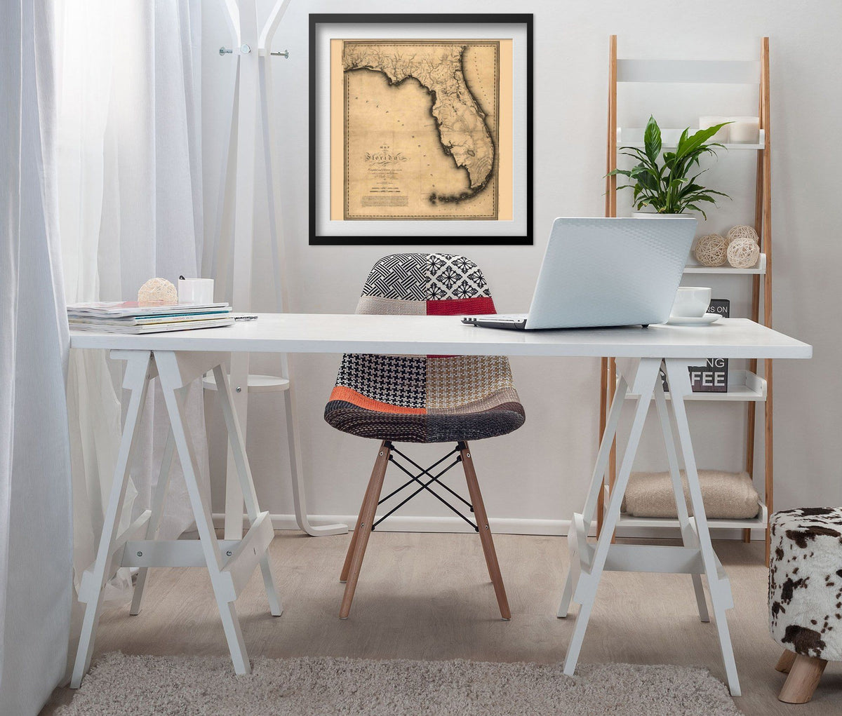Florida 1823 Map print framed above a white desk in a home office