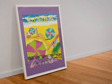 Florida Beach Umbrellas poster in a white frame leaning against a wall