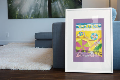Florida Beach Umbrellas poster leaning beside a blue sofa