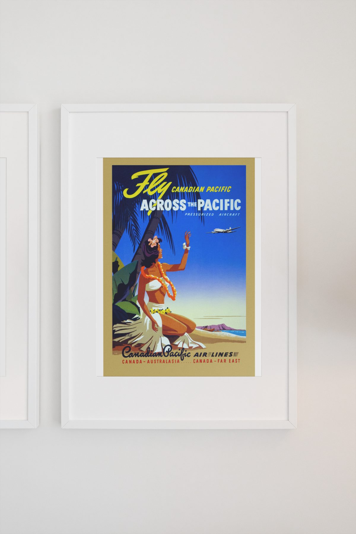 Fly Across the Pacific Canadian Pacific poster on a light wall