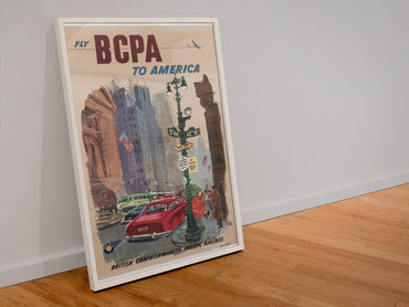 Fly BCPA to America poster in a white frame leaning against a wall