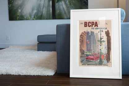 Fly BCPA to America poster leaning beside a blue sofa