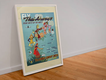 Fly Thai Airways poster in a white frame leaning against a wall