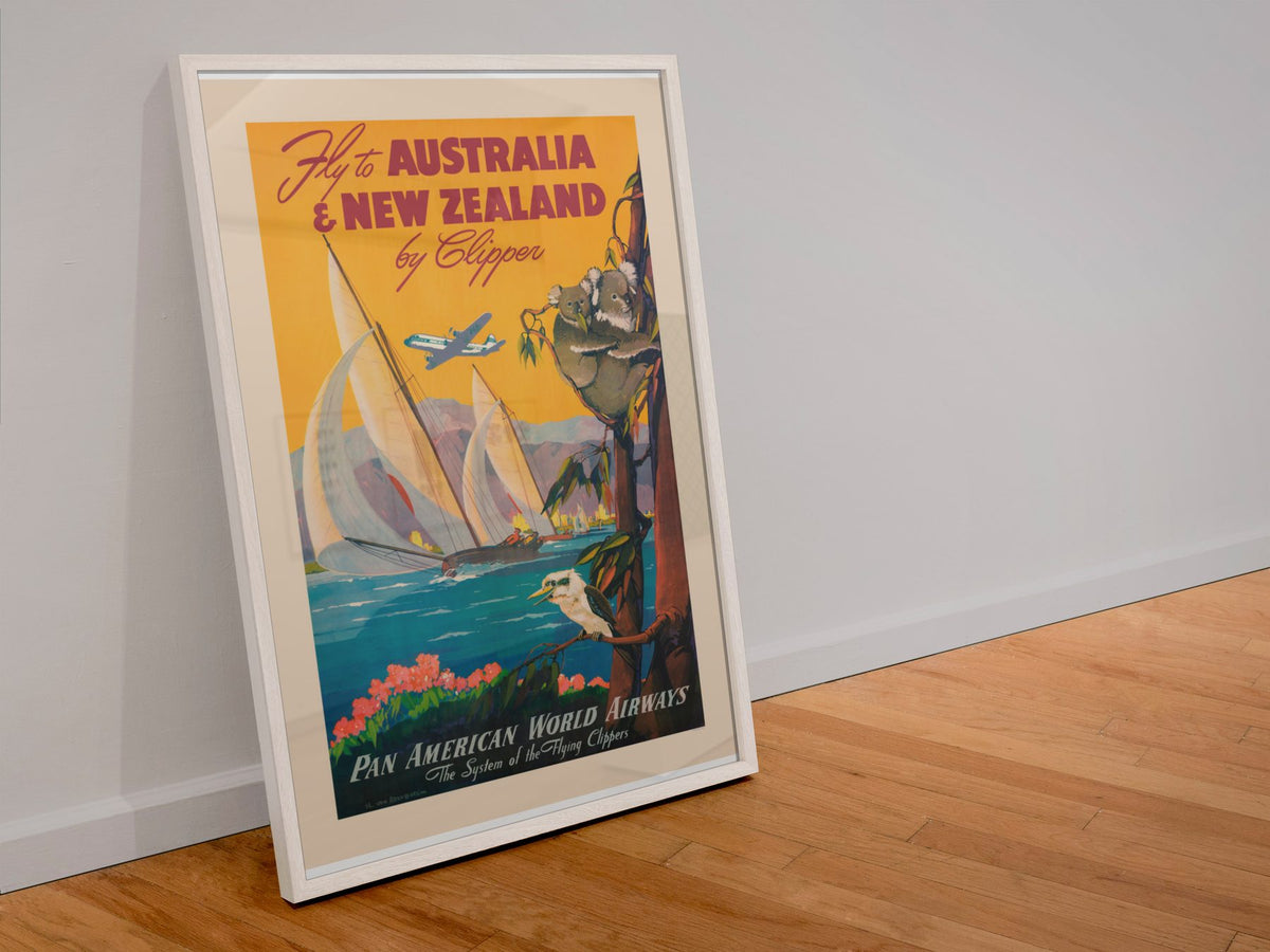 Fly to Australia and New Zealand Pan Am poster in a white frame leaning against a wall