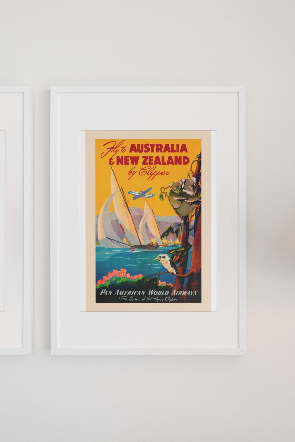 Fly to Australia and New Zealand Pan Am poster on a light wall