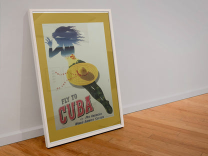 Fly to Cuba Pan American poster in a white frame leaning against a wall
