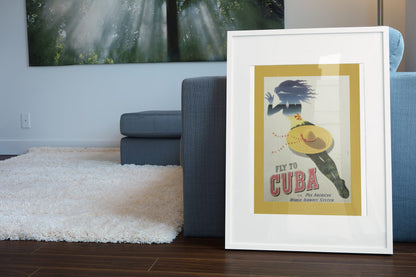 Fly to Cuba Pan American poster leaning beside a blue sofa