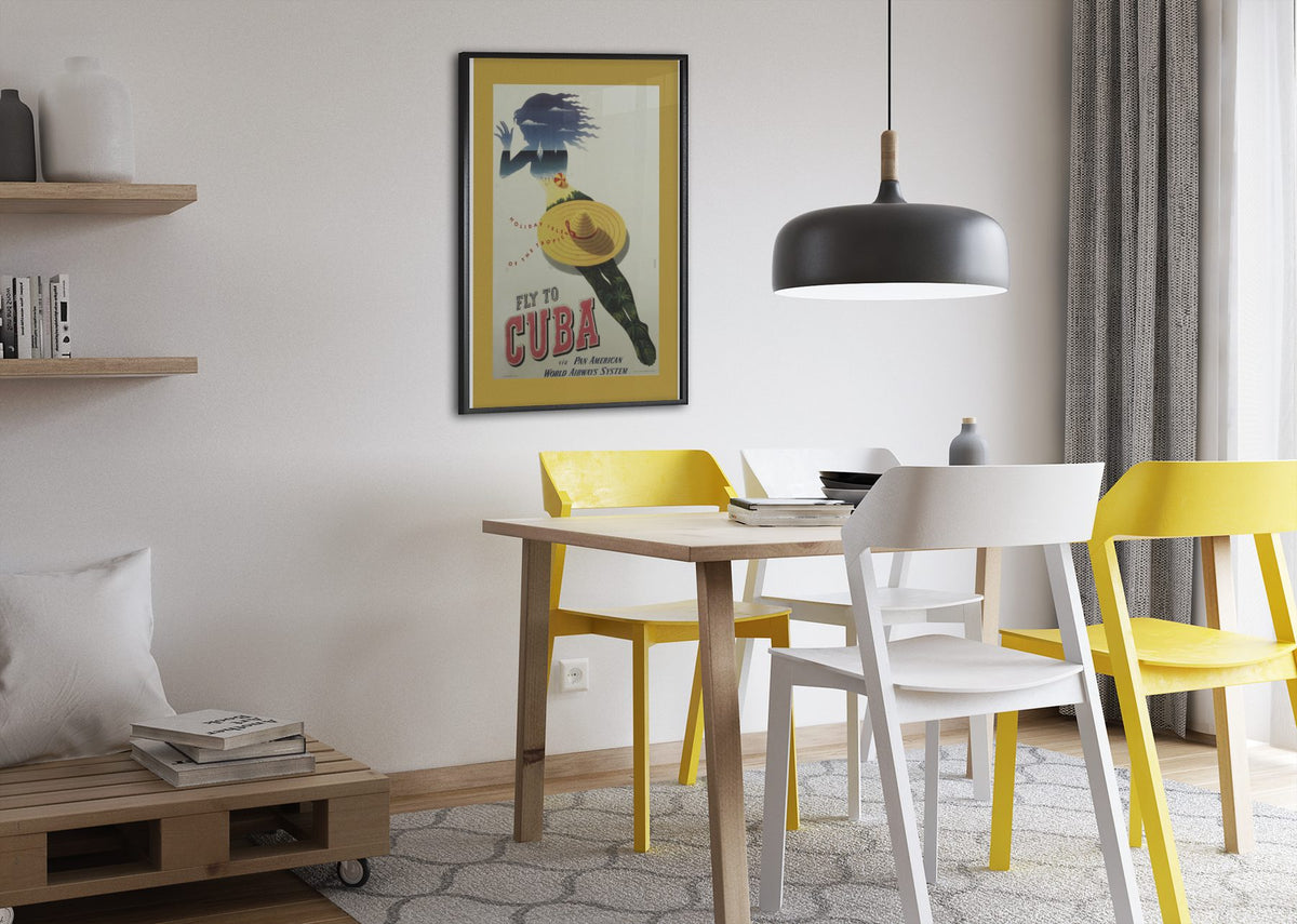 Fly to Cuba Pan American poster framed above a dining table