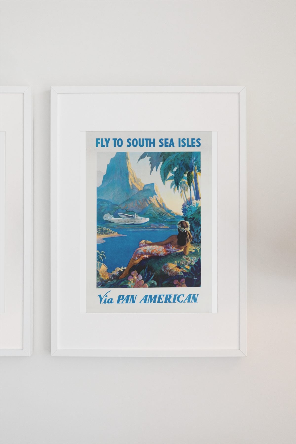 Fly to South Sea Isles Pan American poster on a light wall