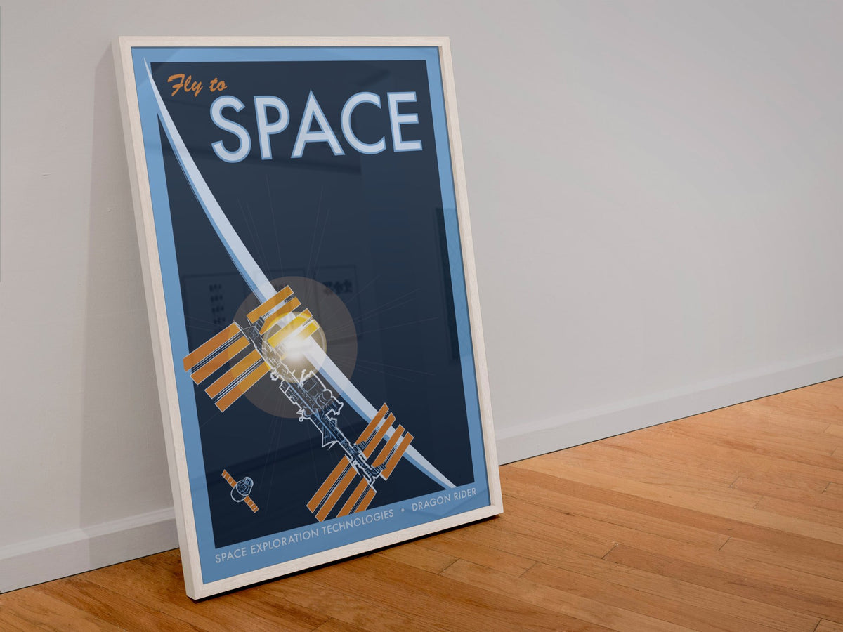 Fly to Space retro space travel poster in a white frame leaning against a wall