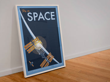Fly to Space retro space travel poster in a white frame leaning against a wall