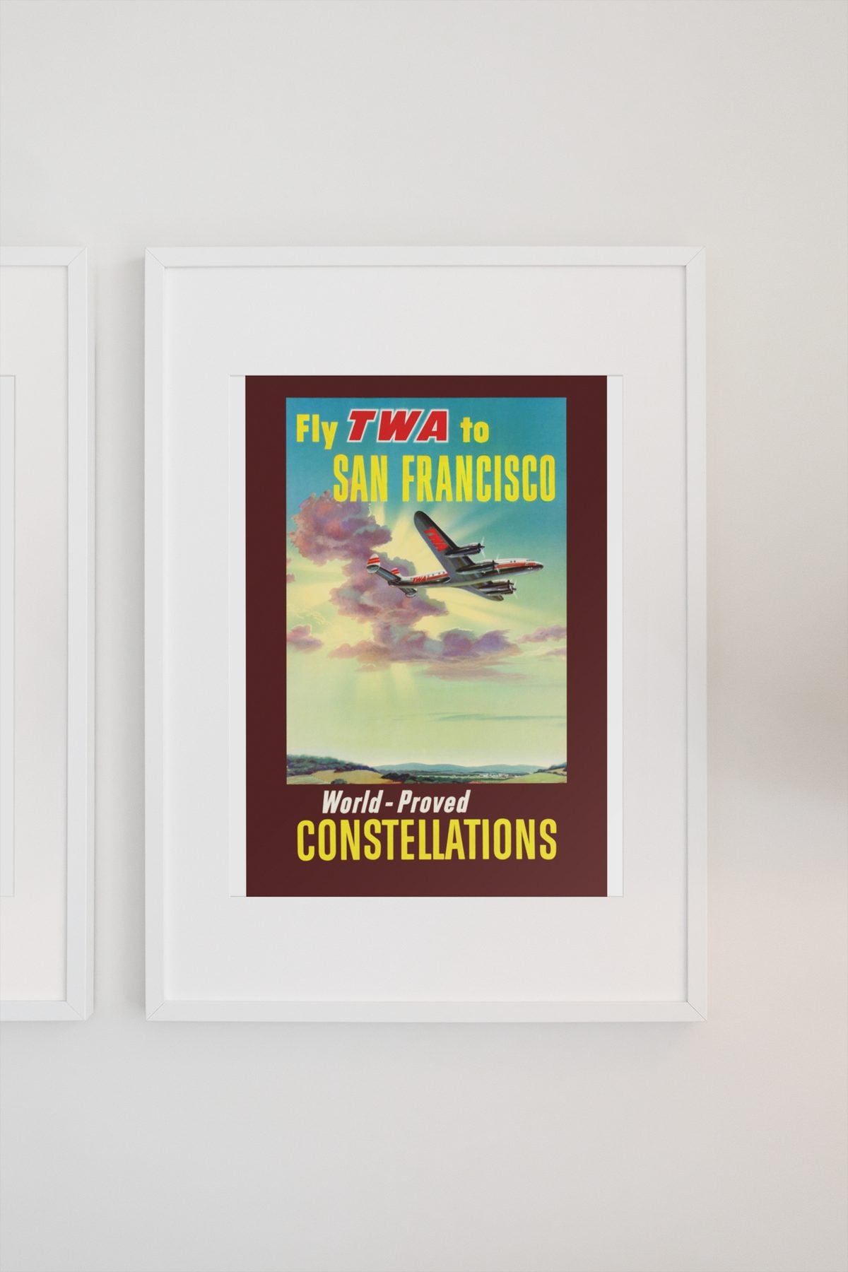 Fly TWA to San Francisco Constellations poster on a light wall