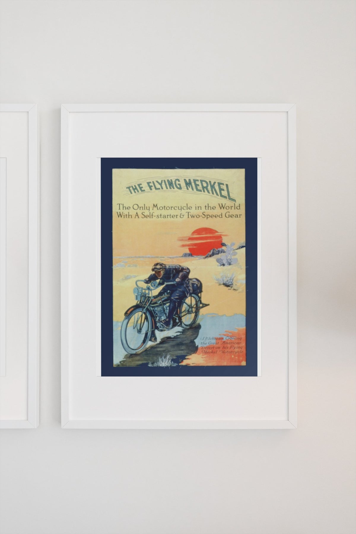 The Flying Merkel 1913 poster in a white frame on a light wall