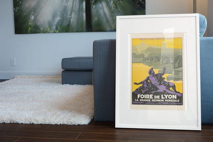 Foire de Lyon poster leaning beside a blue sofa