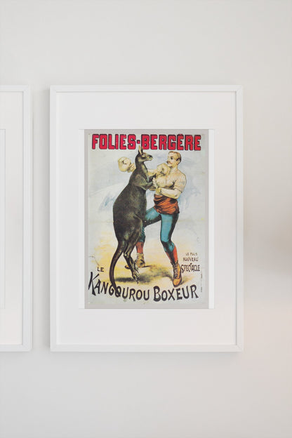 Folies-Bergère Kangaroo Boxer poster in a white frame on a light wall
