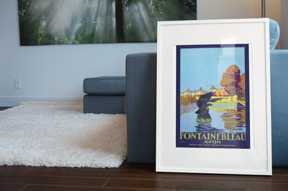 Fontainebleau Avon poster leaning beside a blue sofa