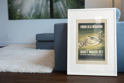 Food Is a Weapon Dont Waste It poster leaning beside a blue sofa