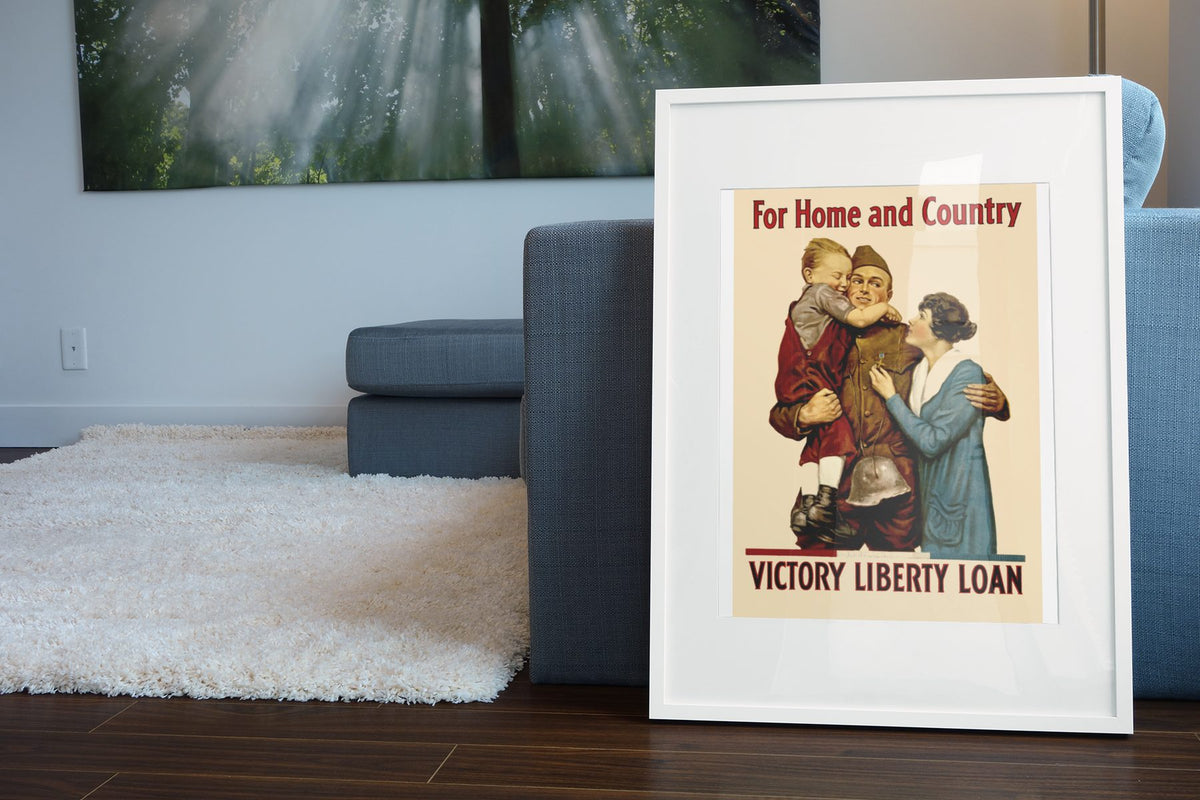 For Home and Country — Victory Liberty Loan poster leaning beside a blue sofa
