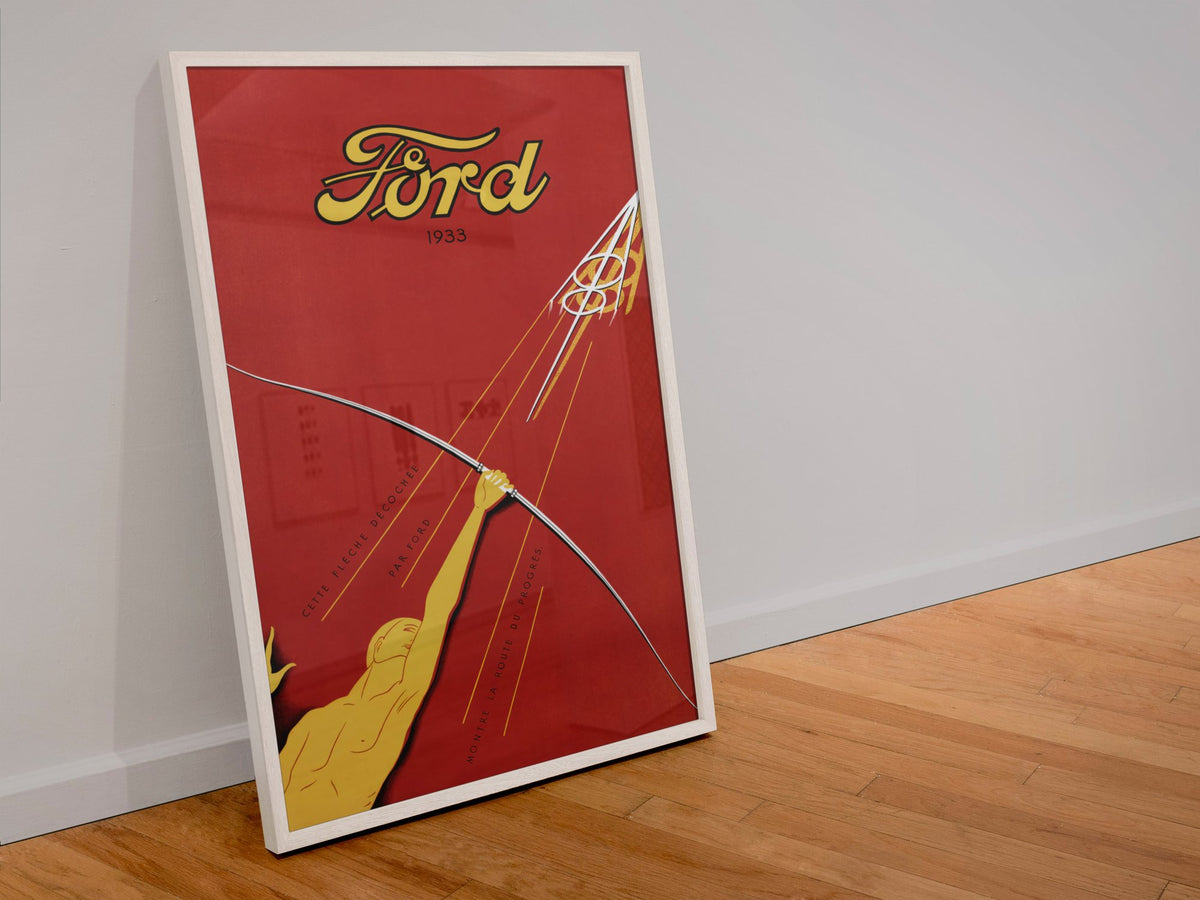 Ford V8 1933 poster in a white frame leaning against a wall