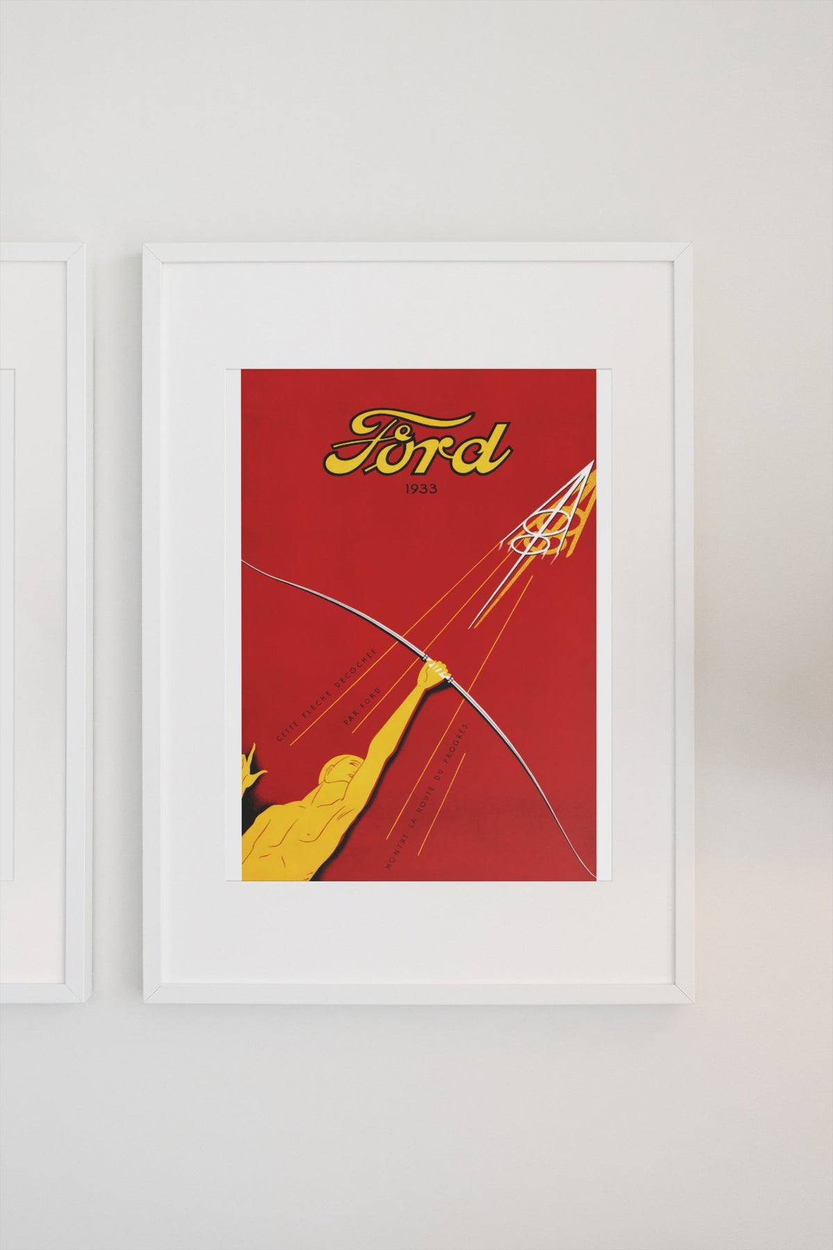 Ford V8 1933 poster in a white frame on a light wall