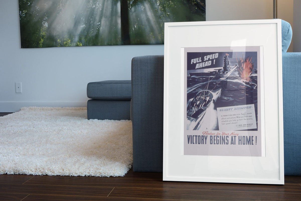 Full Speed Ahead — Victory Begins at Home poster leaning beside a blue sofa