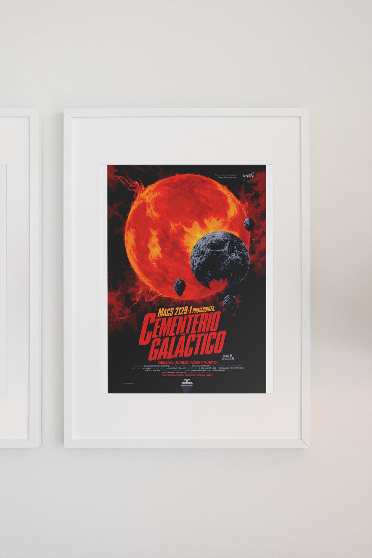 Galactic Graveyard, Cementerio Galáctico Spanish edition poster in a white frame on a light wall