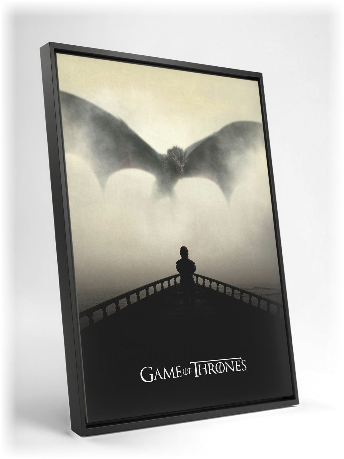 Game of Thrones Dragon Silhouette Art as a black floater framed canvas leaning against a wall
