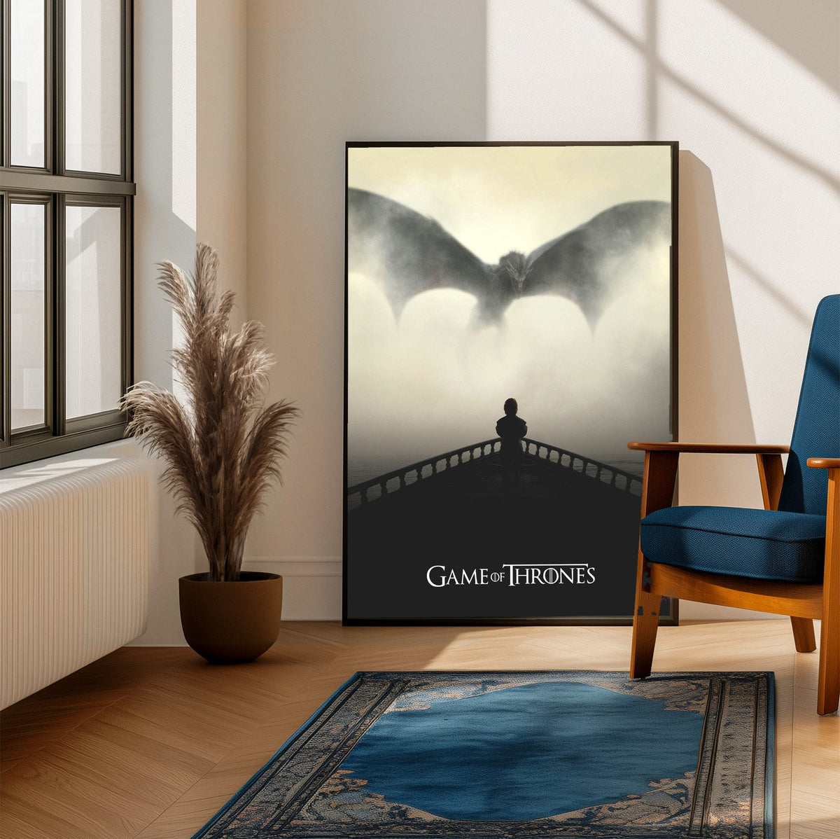 Game of Thrones Dragon Silhouette Art poster framed beside a blue armchair in a sunlit room