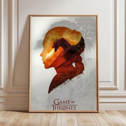 Game of Thrones Silhouette Art poster in a light oak frame leaning against a white wall