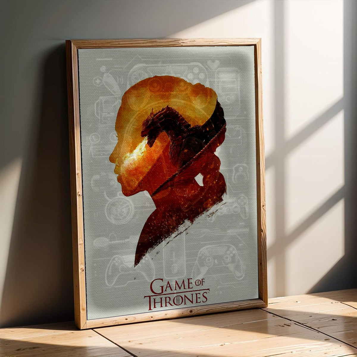 Game of Thrones Silhouette Art poster in an oak frame leaning on a wooden floor