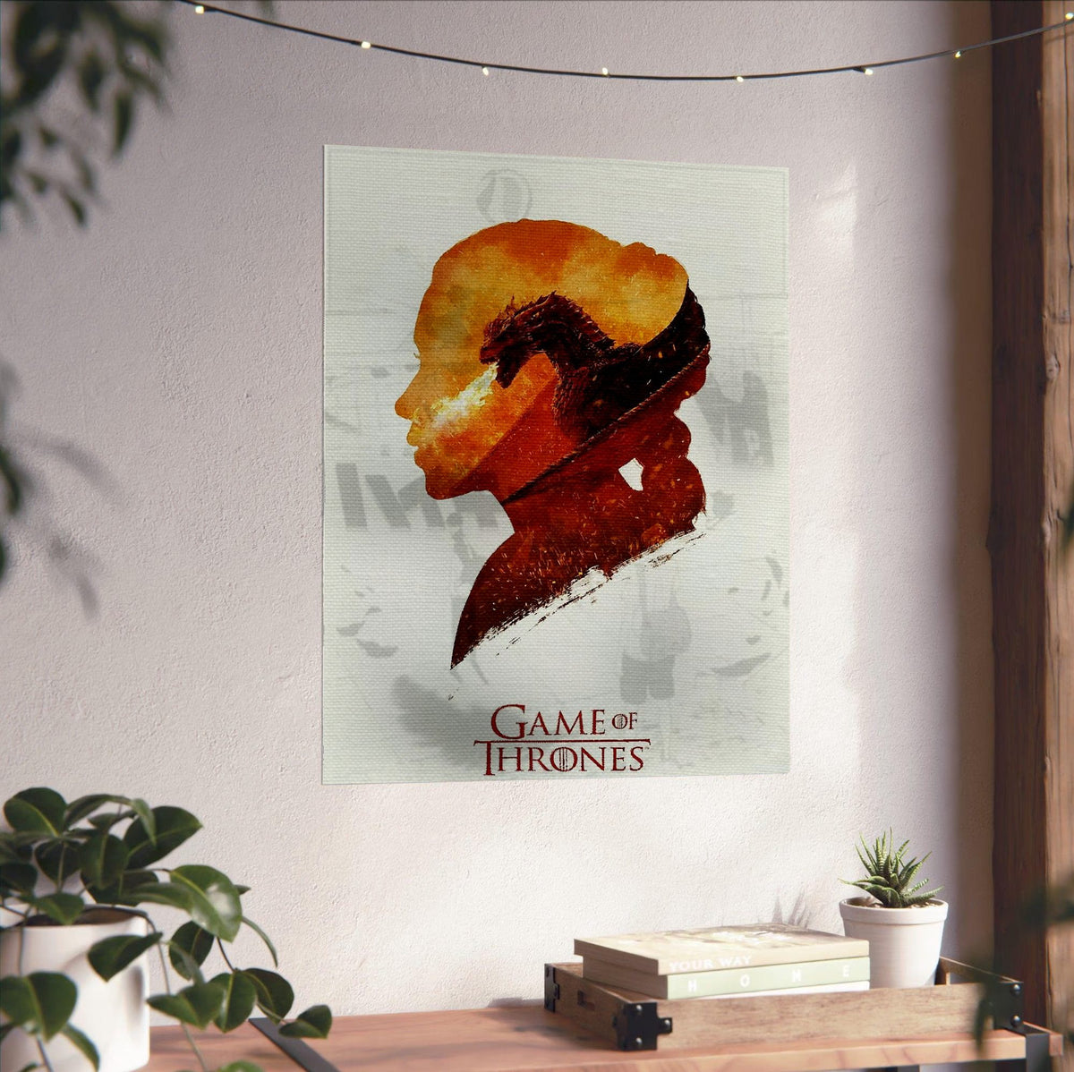Game of Thrones Silhouette Art poster unframed on a white wall above a desk