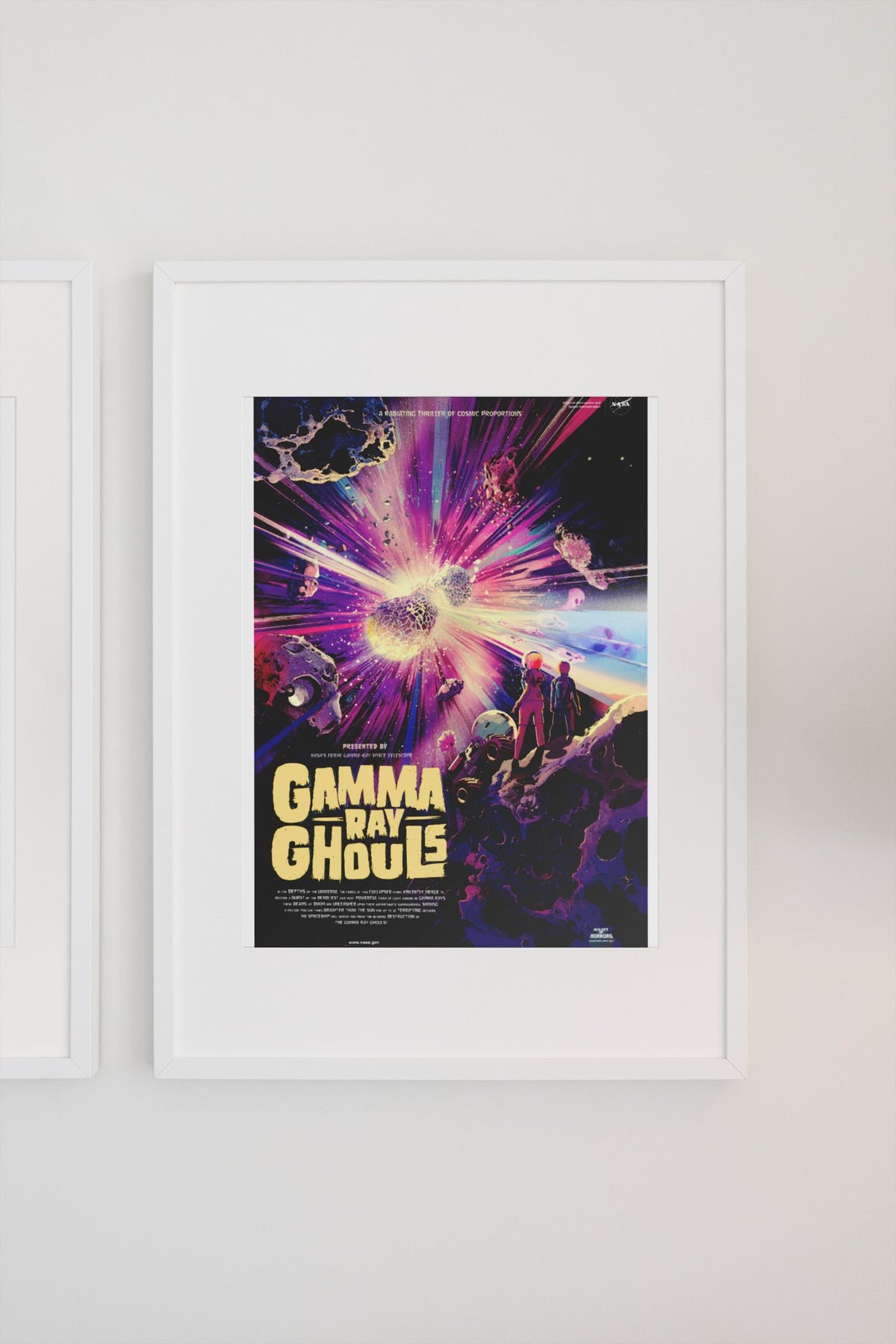 Gamma Ray Ghouls, NASA Galaxy of Horrors poster in a white frame on a light wall