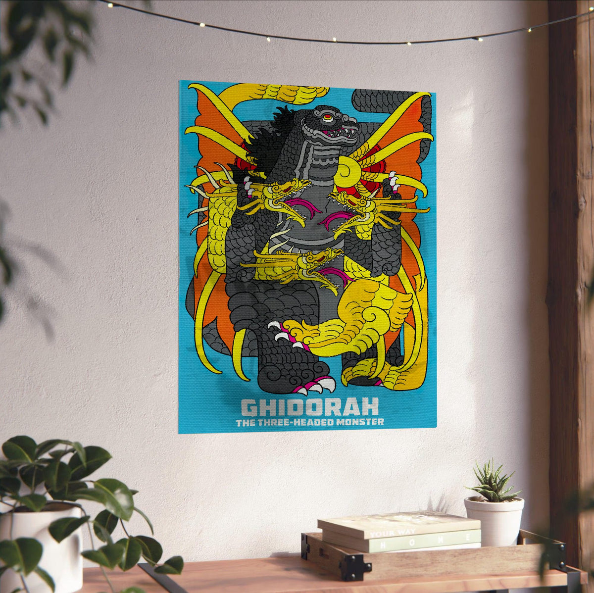 Ghidorah, the Three-Headed Monster (1964) Movie Illustrated Art poster unframed on a white wall above a desk