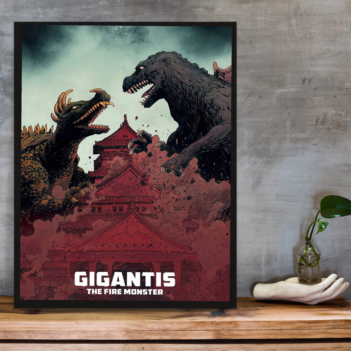 Gigantis, the Fire Monster (1959) Movie Illustrated Art poster in a black frame on a wooden shelf against concrete