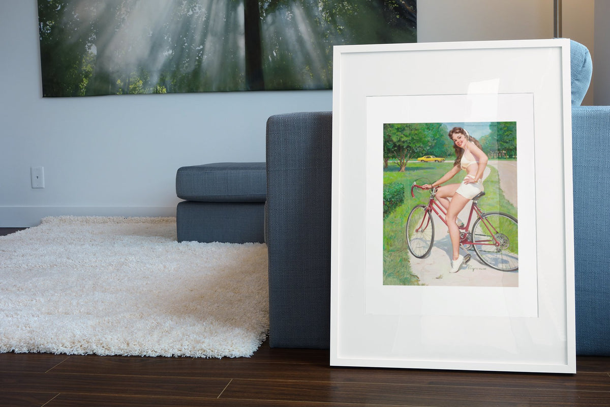 Girl on a Bicycle by Gil Elvgren, pin-up poster — living room wall