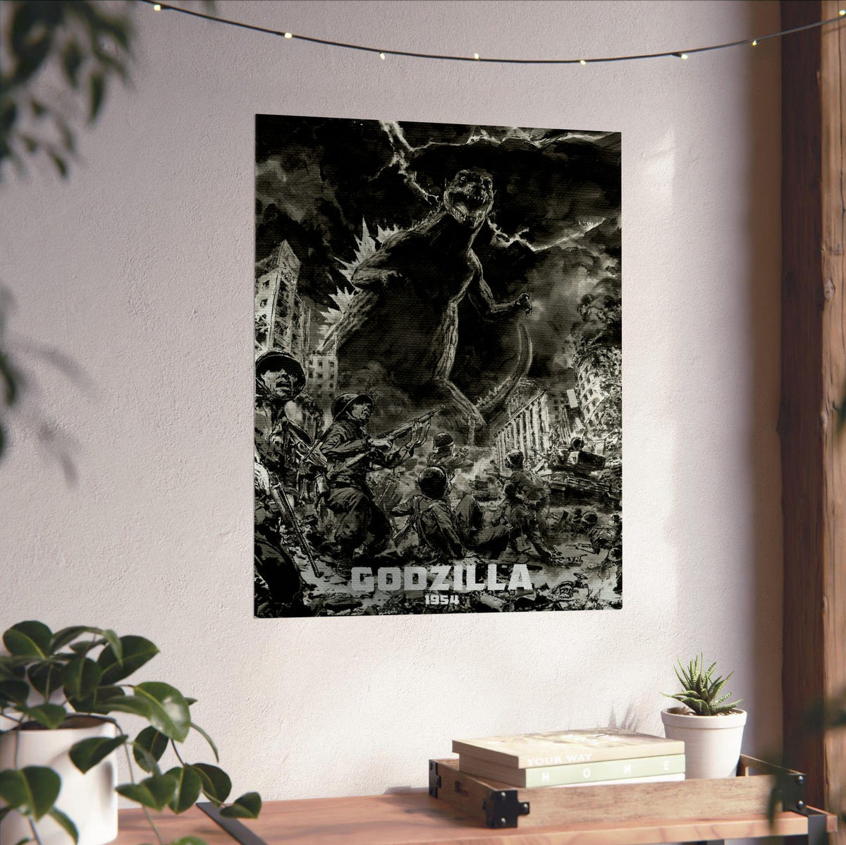 Godzilla (1954) Movie Illustrated Art poster unframed on a white wall above a desk