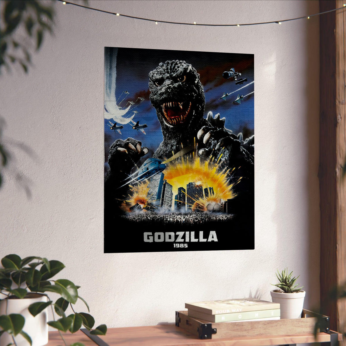 Godzilla 1985 (1985) Movie Key Art poster unframed on a white wall above a desk