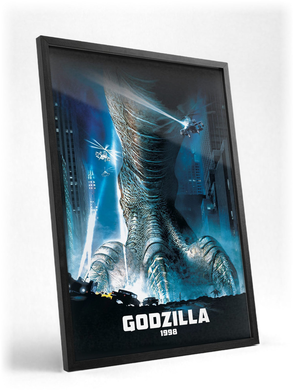 Godzilla (1998) Movie Key Art poster in a black frame with glass leaning against a wall