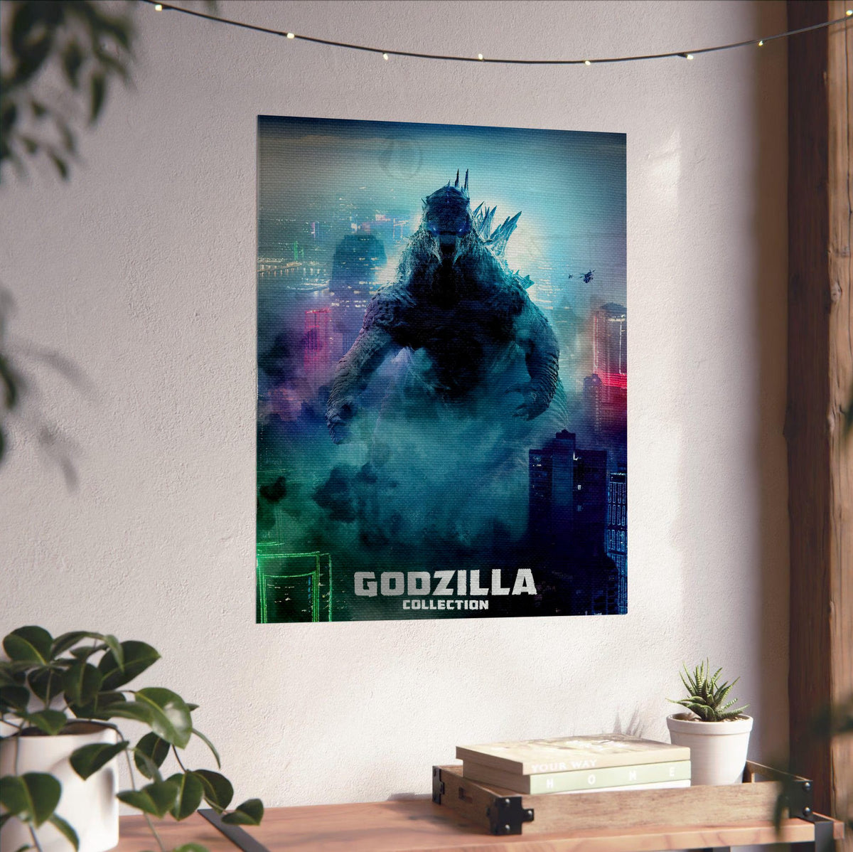 Godzilla Complete Collection Movie Art poster unframed on a white wall above a desk