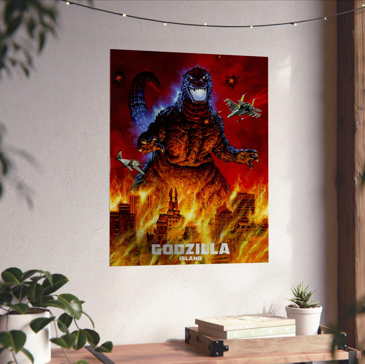 Godzilla Island (1997) Key Art poster unframed on a white wall above a desk