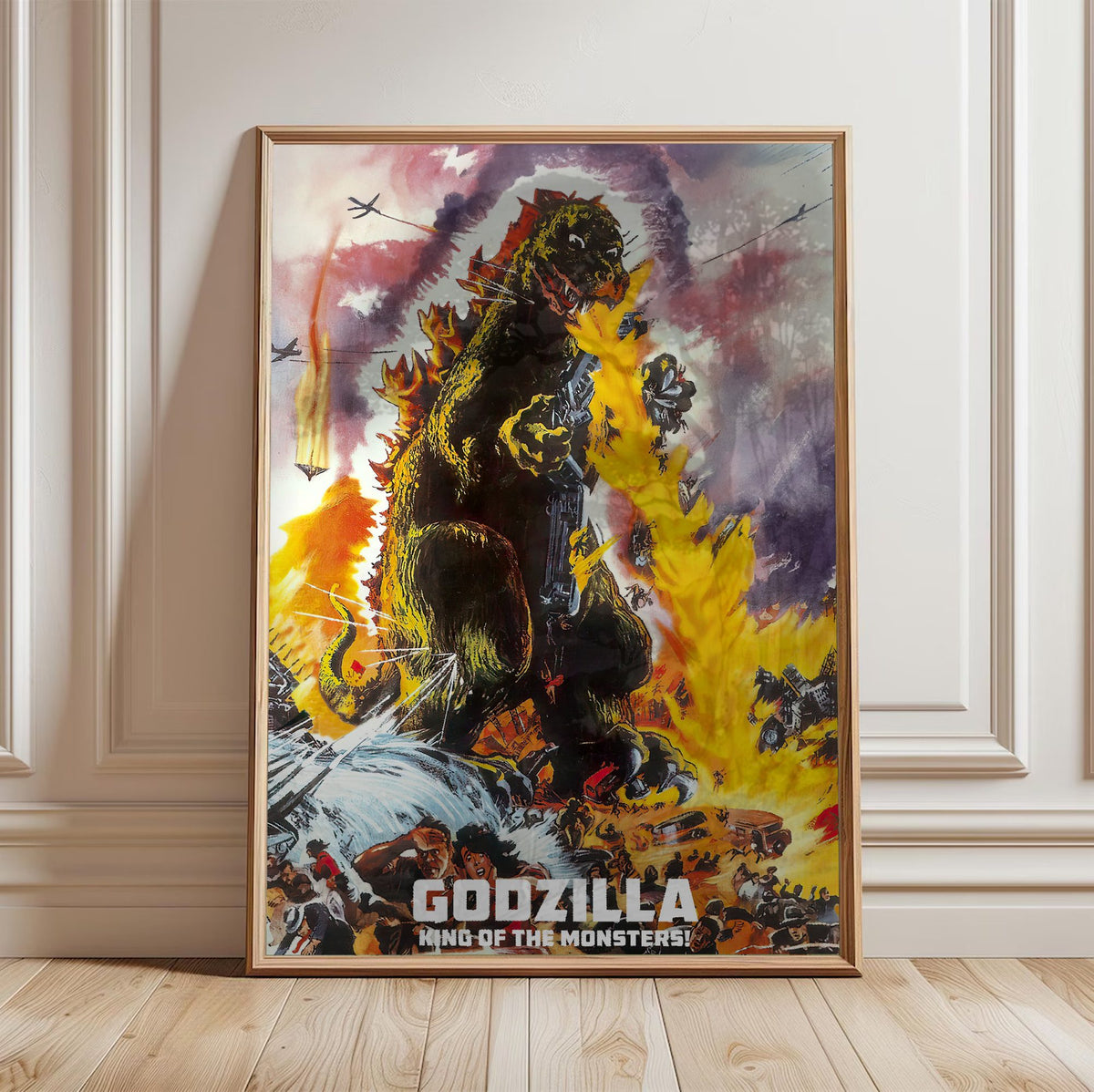 Godzilla, King of the Monsters! (1956) Movie Illustrated Art poster in a light oak frame leaning against a white wall