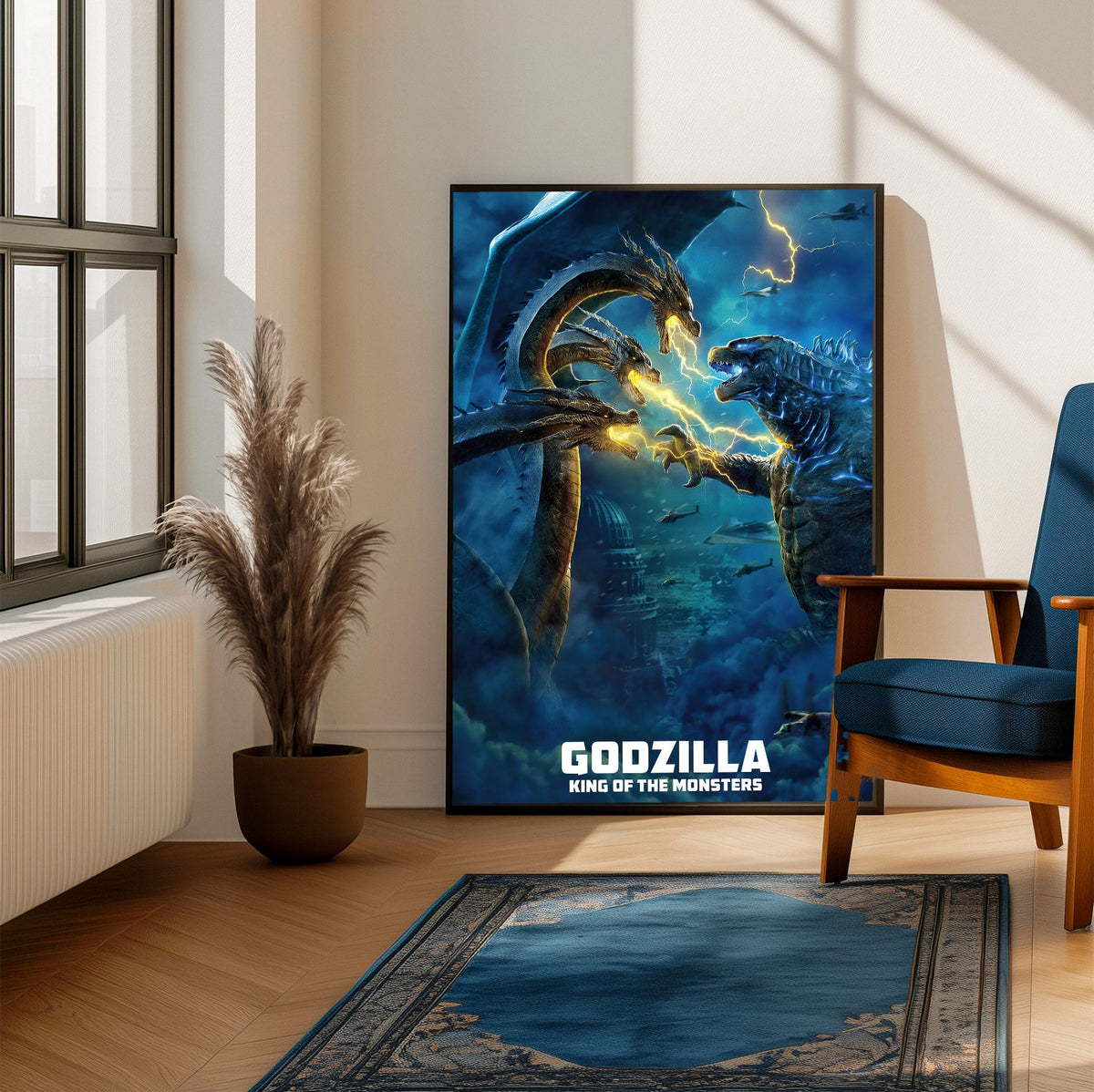 Godzilla: King of the Monsters (2019) Movie Ghidorah Battle Art poster framed beside a blue armchair in a sunlit room